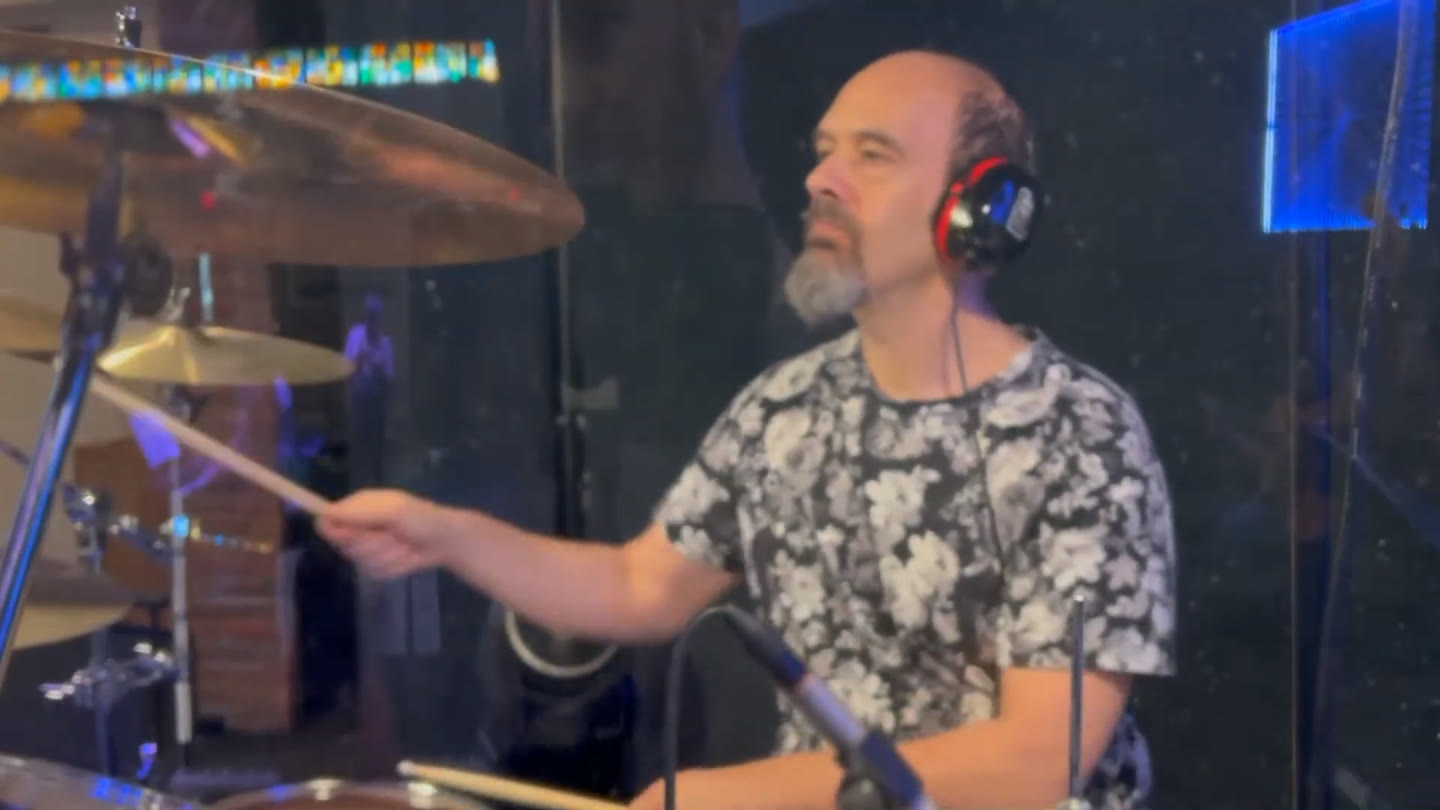 David Moskowitz playing the full drum kit during a church service